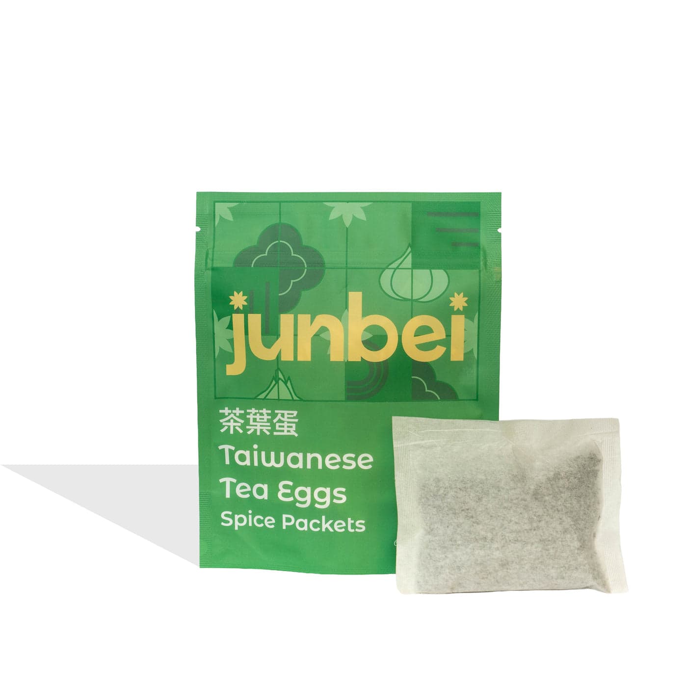 Junbei Taiwanese Tea Eggs spice packet pouch with a spice packet beside it